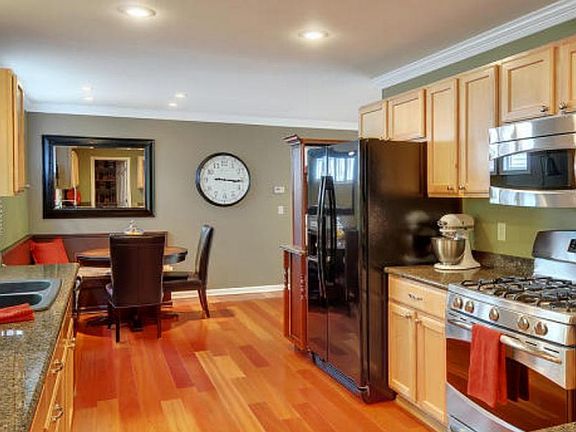 Beautiful kitchen with stainless steel appliances and granit