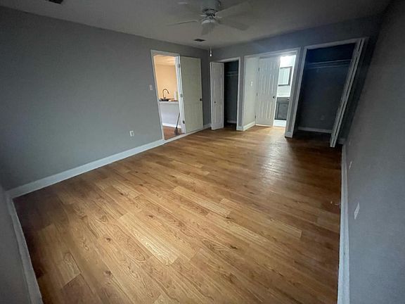 Large primary bedroom with 2 closets and en suite bathroom
