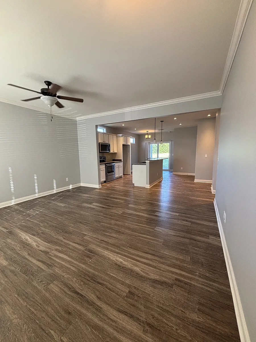 Living room area open to kitchen area - 100 The Masters