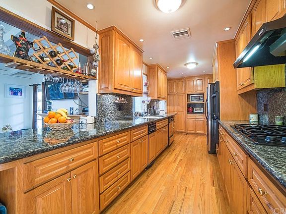 Remodeled granite kitchen with loads of fine cabin