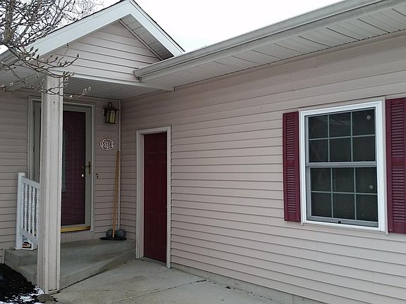Front Door Entrance and Walk-in Garage Door