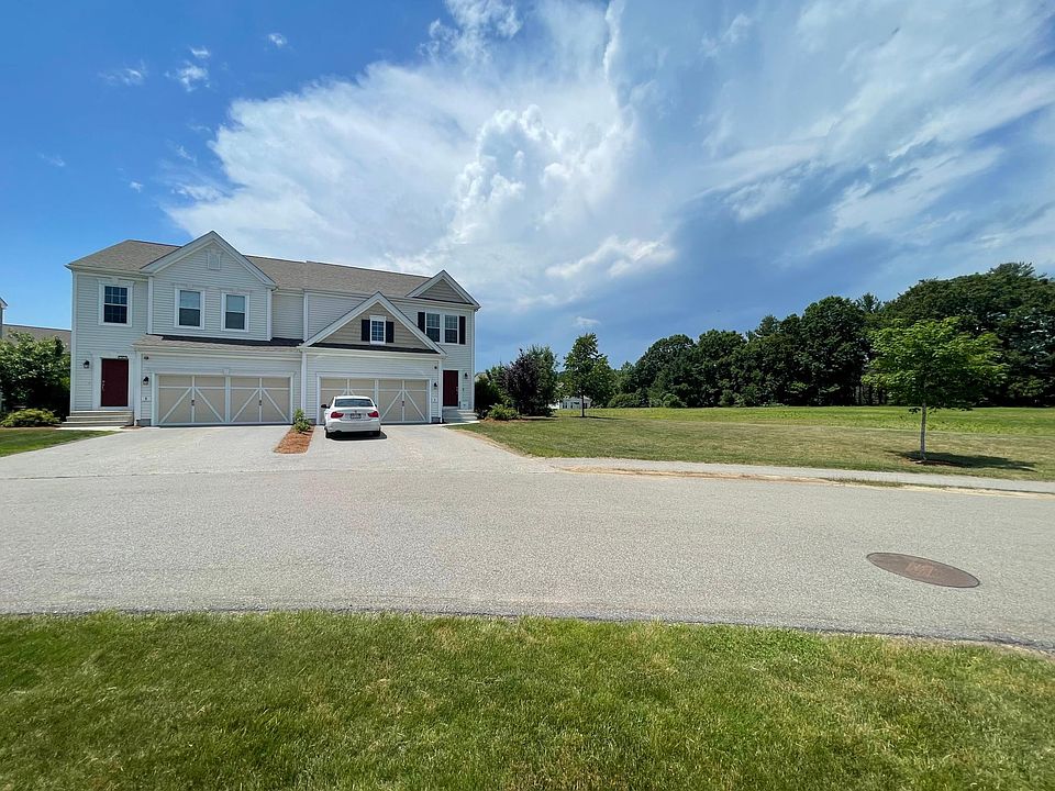 Front of the house. #7 is on the right with car parked on the driveway