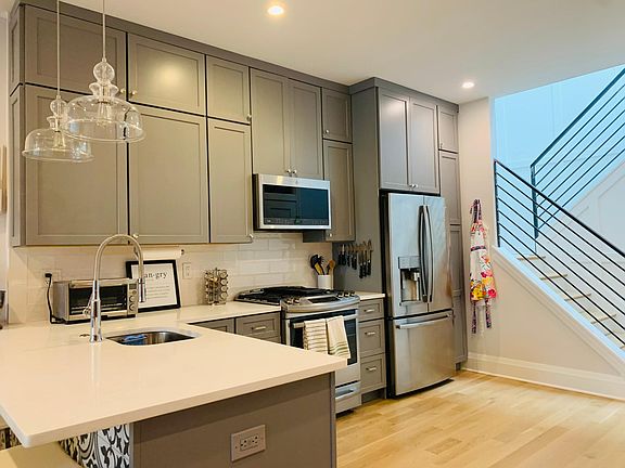 1st Level- Large Kitchen w/ Stainless Steel Appliances, Half Bath to the Right