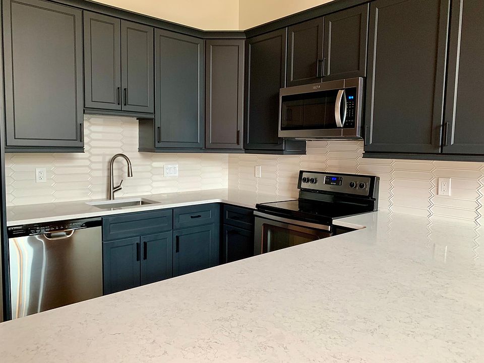 Quartz countertops, deep stainless sink, new appliances