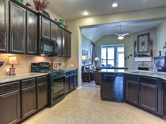 Loads of counter tops and cabinets; gas range; great work triangle.