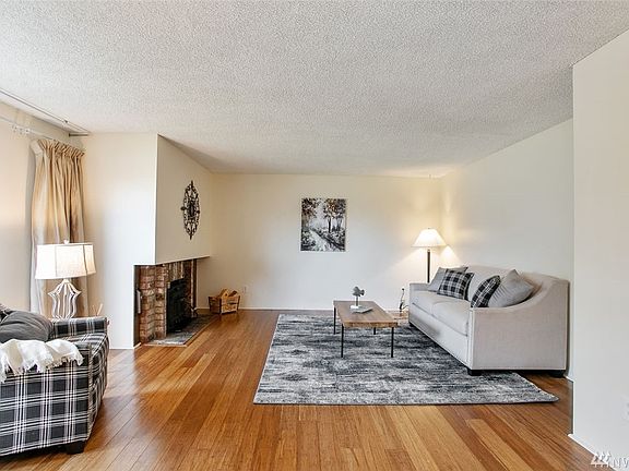 As you enter this spacious home you'll love the formal living room. Check out the gorgeous hardwood floors and warm fireplace.