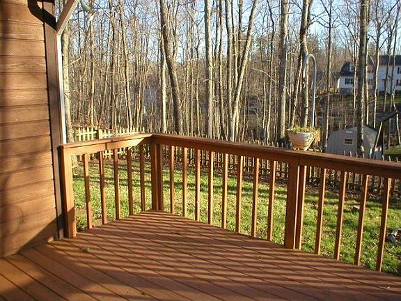 Deck and fenced back yard