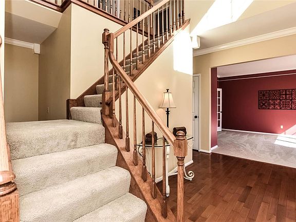 Stunning T stairway with all new carpet leads upstairs to the four spacious bedrooms.