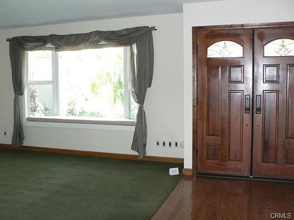 Beautiful entry with double doors and leaded glass windows. Oak