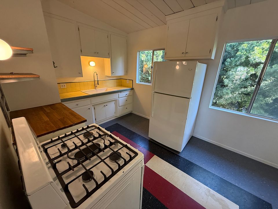 Kitchen with range, refrigerator and dishwasher