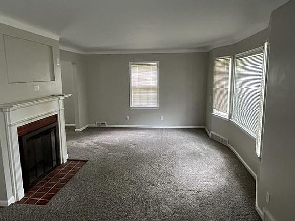 Living room with wood burning fireplace