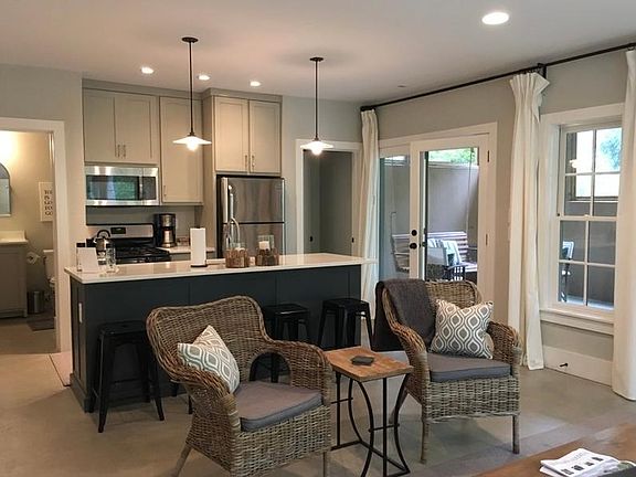 Kitchen with view of screened porch.