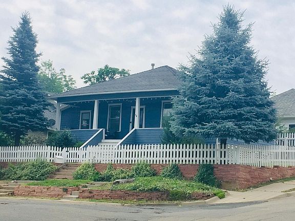 Corner lot, located on southwest corner of 4th & Concord Ave. Wrap around porch tucked behind pine tree with west and south views. Mounting for exterior TV, speakers wired.
