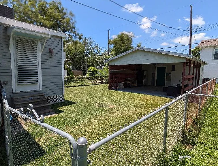 Fenced backyard w/carport. Carport is great for use as covered outdoor patio.