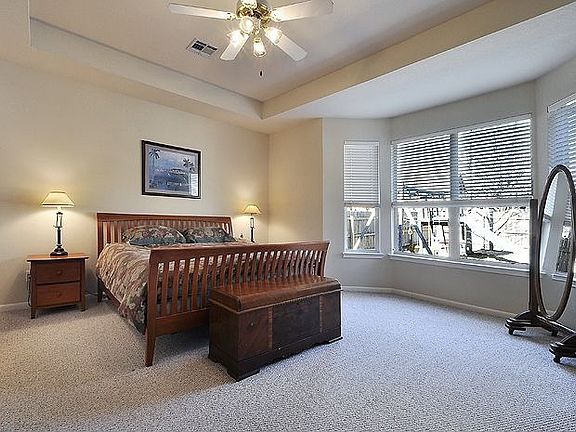 Large master bedroom with huge windows