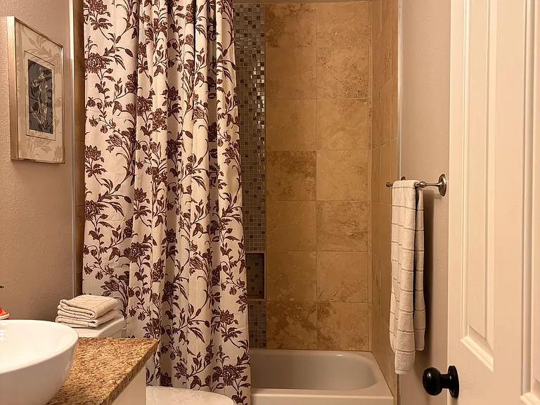 Full guest bath with clean, modern finishes.