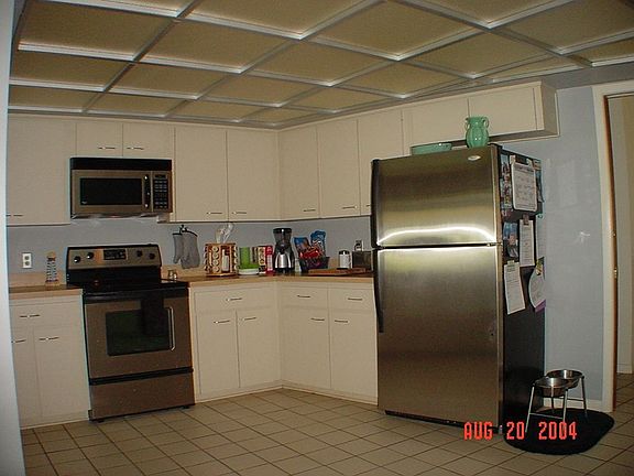 Large kitchen with all stainless appliances.