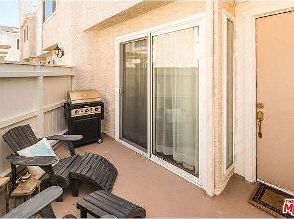 outdoor patio open to the unit's main door & living room