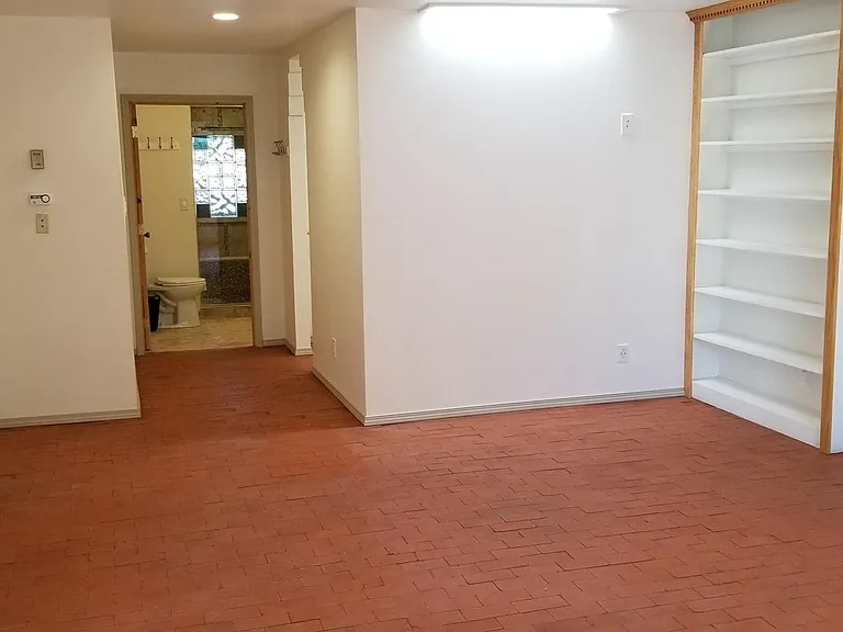 600 SF (shown here unfurnished) Master Suite (west end) with private bath, walk-in closet, built in book shelves and fireplace