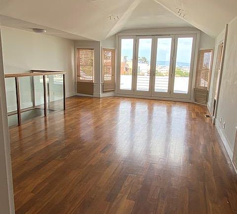 Large open living/dining room with tons of light and views