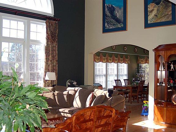 Two-story family room w/wall of windows!