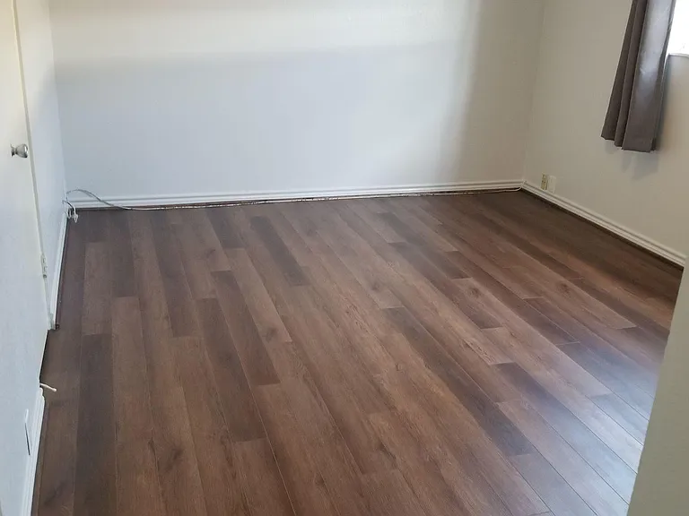 Both bedrooms with newly installed vinyl flooring.
