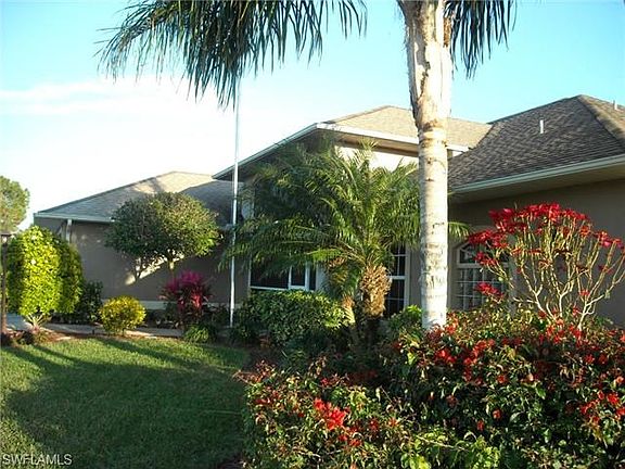 Lush tropical plantings surround this home.