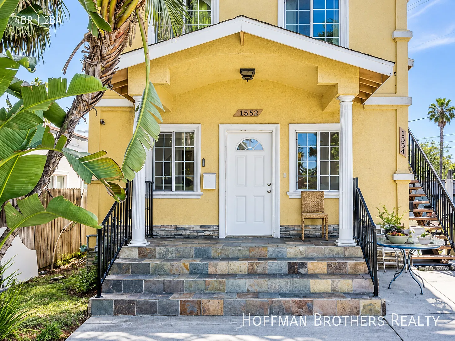 Renovated Townhouse with Open-Concept Living, Porch, In-Unit Laundry And Parking — Photo 3