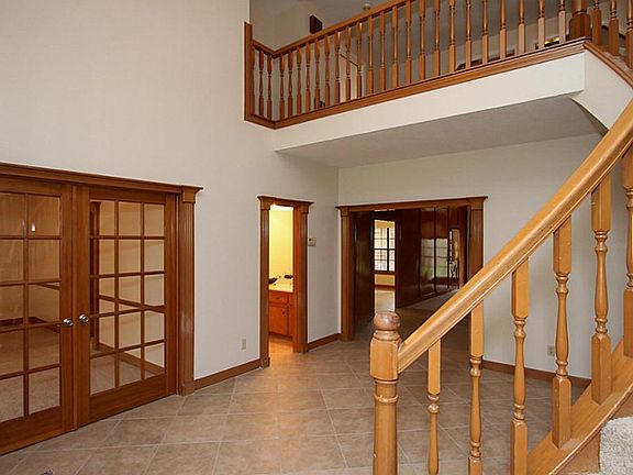 Large entry with French doors leading to the Formal Dining Room.