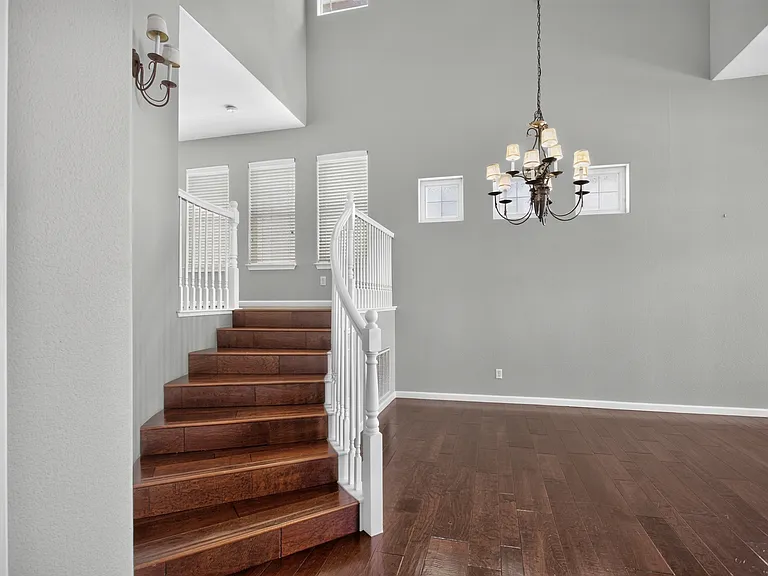 Hardwood stairs to main level living/dining room combination.