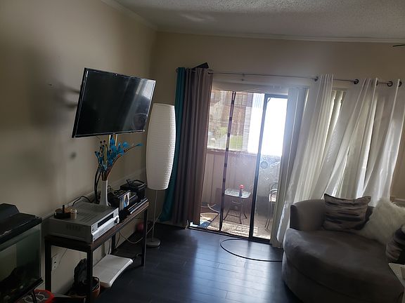 Left side of living room and balcony.