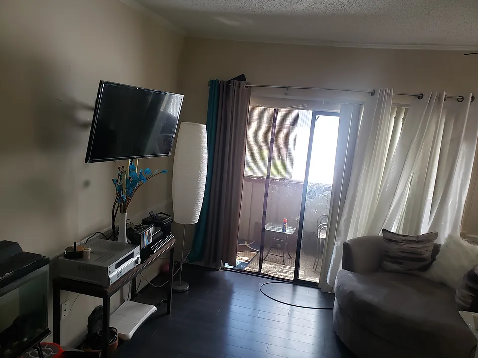 Left side of living room and balcony.