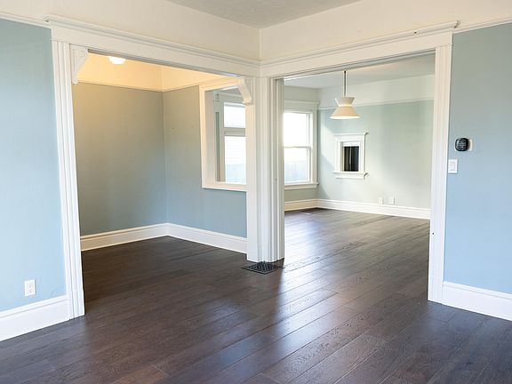 Standing in the living room (13 ft x 13 ft) looking at the entryway (7 ft x 8 ft) and middle room (13 ft x 15 ft)