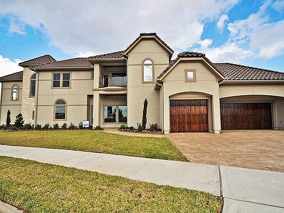 SIDE VIEW OF HOME WITH SIDE ENTRY & W/3-CAR!GARAGE!