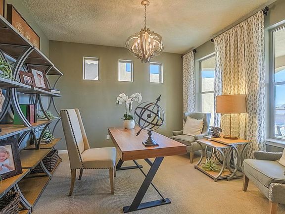 Quiet den at the front of the house makes a great home office.