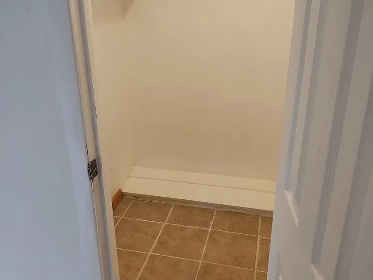 Left side of Middle Bedroom closet.