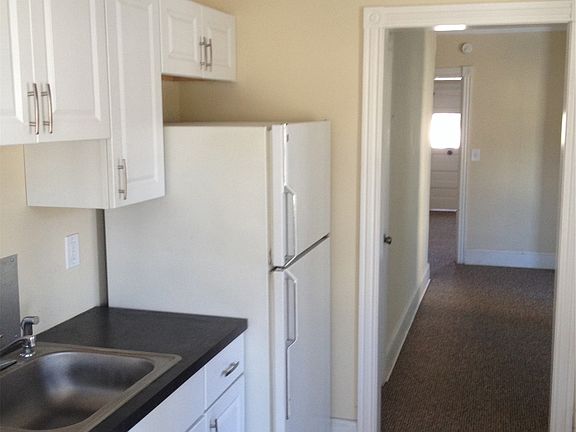 Kitchen into Dining Room into Living Room
