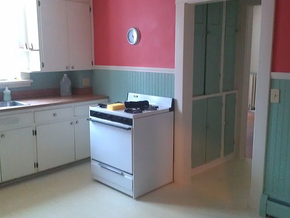 kitchen with gas range and fridge