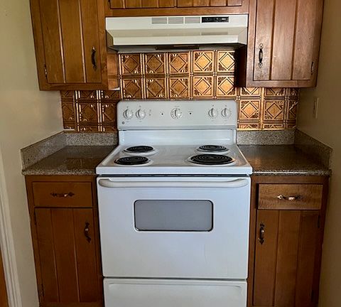 Full size stove with more cabinet and drawer space convenient to the stove. Stylishly decorated with real copper backsplash for easy cleaning.