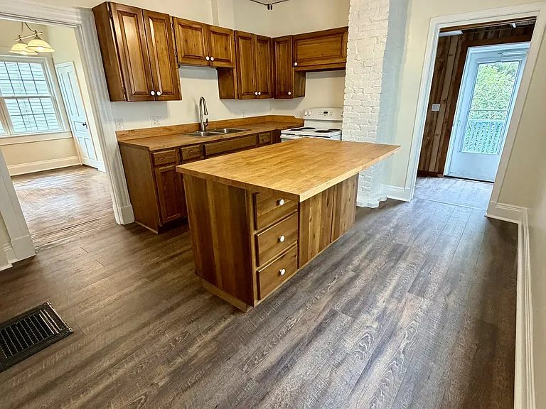 Mud room off of kitchen with access to rear porch and yard.