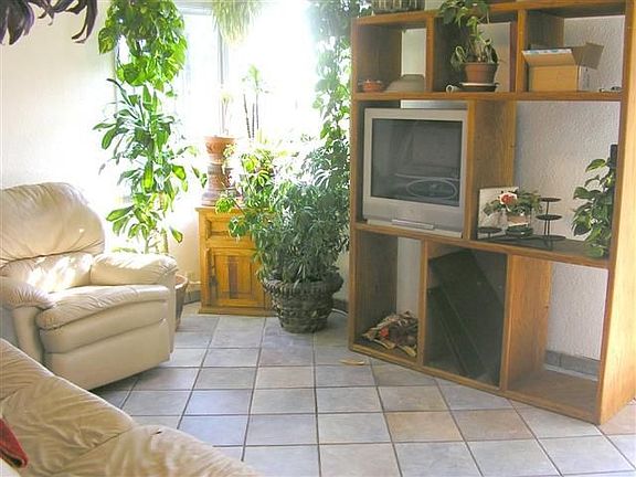 Lovely Tile flooring in Living Room of Main Home