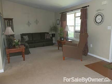 Living Room
						:
						Front entry is at the small section of wood floor.