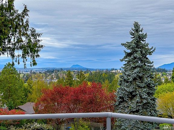 Nestled as if on top of the world!  You can experience views like this each and every day.  Imagine enjoying a cup of coffee or winding down the evening with a glass of wine, while sitting on your expansive newer composite deck enjoying these views. 