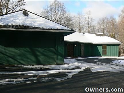 Garage view and newly paved driveway