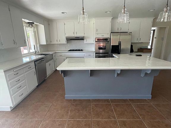 Another kitchen view. Stools are a great addition to the center island.