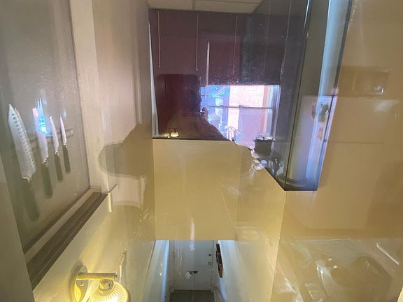 Apartment has large glass windows giving you a view of your private staircase down below.