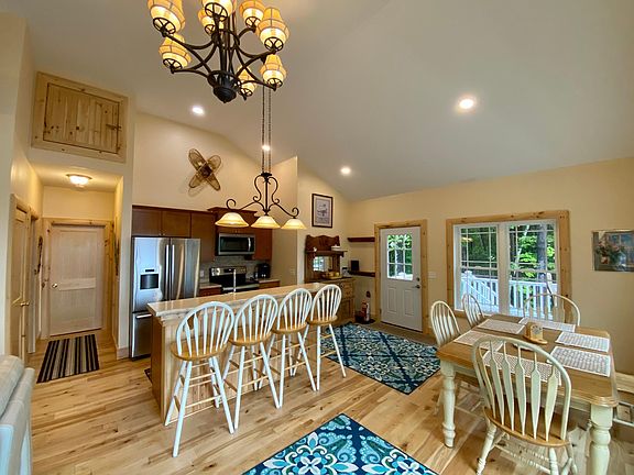 View of dinning area, island and kitchen