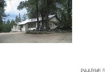 Mobile Home nestled in pines