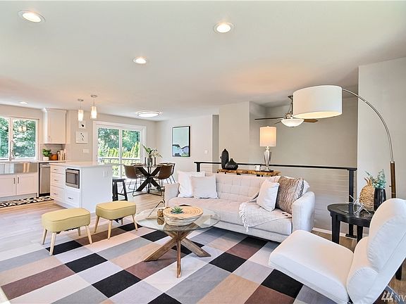 Open concept living room with kitchen and dining room. Lots of natural light!