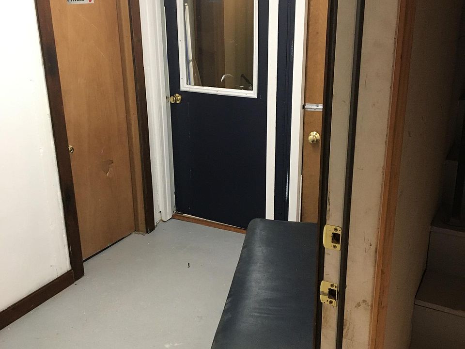 Nicely worked and trimmed out foyer/mud room entry area into apartment. Bench may be used by tenant,